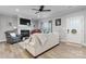 Bright living room with a cozy fireplace, comfortable seating, and a piano adding a touch of elegance to the space at 4949 Southview Dr, Hickory, NC 28602
