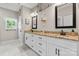 Elegant bathroom featuring double vanity with granite countertops and white cabinets at 4949 Southview Dr, Hickory, NC 28602