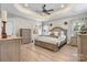 Spacious main bedroom with tray ceilings, neutral colors, and luxury vinyl flooring at 4949 Southview Dr, Hickory, NC 28602