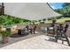 Outdoor patio featuring stone accents, a grill, cooler, and a shade, great for outdoor entertaining at 4949 Southview Dr, Hickory, NC 28602