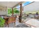 Enjoy the outdoor patio with wooden furniture, brick accents, and shade, perfect for relaxing or entertaining at 4949 Southview Dr, Hickory, NC 28602