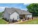 Charming home with a covered back porch, stone foundation, and manicured landscaping at 4949 Southview Dr, Hickory, NC 28602