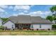 Beautiful home featuring a covered back porch perfect for relaxation, surrounded by lush greenery at 4949 Southview Dr, Hickory, NC 28602