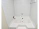 Bright bathroom showcasing a luxurious soaking tub with white tile surround at 5601 Carmel Station Ave, Charlotte, NC 28226