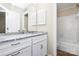 Well-lit bathroom featuring white cabinetry and a granite countertop sink at 5601 Carmel Station Ave, Charlotte, NC 28226