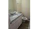 This bathroom features a toilet, sink, mirror and neutral tones throughout at 5601 Carmel Station Ave, Charlotte, NC 28226