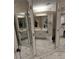 Bright bathroom features large vanity with mirrors, vanity and sink at 5601 Carmel Station Ave, Charlotte, NC 28226