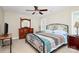 Bedroom with a bed, dresser, and ceiling fan at 5601 Carmel Station Ave, Charlotte, NC 28226