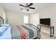 Bedroom featuring a ceiling fan and a colorful quilt on the bed at 5601 Carmel Station Ave, Charlotte, NC 28226