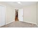 Bedroom with closet and doorway with hardwood flooring visible at 5601 Carmel Station Ave, Charlotte, NC 28226
