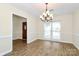 Bright dining room with new floors, stylish lighting, and ample natural light at 5601 Carmel Station Ave, Charlotte, NC 28226