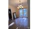 Bright dining room with large window, chandelier, and ample space for entertaining at 5601 Carmel Station Ave, Charlotte, NC 28226