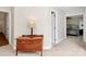 Hallway featuring a wooden dresser and a view into a bedroom at 5601 Carmel Station Ave, Charlotte, NC 28226