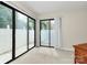 Bright room with sliding glass doors leading to a patio at 5601 Carmel Station Ave, Charlotte, NC 28226