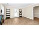 Bright, open living space featuring stylish ladders, wood-look floors, and neutral wall at 5601 Carmel Station Ave, Charlotte, NC 28226