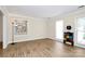 Inviting living space with a modern color cabinet, hardwood floors, and lots of natural light at 5601 Carmel Station Ave, Charlotte, NC 28226