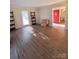 Open living room boasts hardwood floors and plenty of natural light at 5601 Carmel Station Ave, Charlotte, NC 28226
