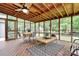 Screened-in porch featuring outdoor seating and screened walls at 5601 Carmel Station Ave, Charlotte, NC 28226