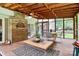 Covered screened porch featuring brick column and outdoor seating at 5601 Carmel Station Ave, Charlotte, NC 28226