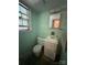 Bathroom featuring a toilet, single sink vanity, medicine cabinet and window at 5938 Sharon Rd, Charlotte, NC 28210