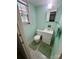 Small bathroom with a white vanity, toilet, and a window for natural light at 5938 Sharon Rd, Charlotte, NC 28210