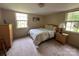 Comfortable bedroom with neutral carpet, two windows and space for a double bed at 5938 Sharon Rd, Charlotte, NC 28210