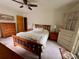 Spacious bedroom featuring a comfortable bed, wood furniture, and serene natural light at 5938 Sharon Rd, Charlotte, NC 28210