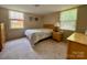 Inviting bedroom with neutral decor, featuring a comfortable bed and ample natural light at 5938 Sharon Rd, Charlotte, NC 28210