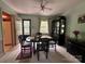 Classic dining room features a black dining set, china cabinet and natural light at 5938 Sharon Rd, Charlotte, NC 28210