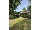 Beautiful home with a covered porch, manicured lawn, and lush greenery, offering a serene setting at 5938 Sharon Rd, Charlotte, NC 28210