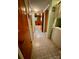 Entry hallway with tile flooring, storage closet, and doorway to a sunlit room at 5938 Sharon Rd, Charlotte, NC 28210