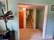 Inviting hallway featuring a staircase and neutral decor, creating a warm atmosphere at 5938 Sharon Rd, Charlotte, NC 28210