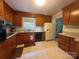 Traditional kitchen with wooden cabinets, and appliances, offering functionality and a classic style at 5938 Sharon Rd, Charlotte, NC 28210