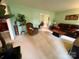 Spacious living room with light walls, plush carpet, and large windows bringing in plenty of natural light at 5938 Sharon Rd, Charlotte, NC 28210