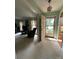 Inviting living room features neutral carpet, an open entrance, and bright natural light at 5938 Sharon Rd, Charlotte, NC 28210