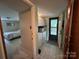 Mud room with laundry area that includes a washer, dryer, storage, and convenient outside access at 5938 Sharon Rd, Charlotte, NC 28210
