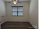 Bright bedroom featuring a window and a closet door, with modern flooring at 6642 Star Dr, Sherrills Ford, NC 28673