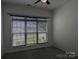 Bedroom showcasing a large window with blinds, offering natural light at 6642 Star Dr, Sherrills Ford, NC 28673