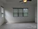 Spacious carpeted bedroom with bright windows and a ceiling fan offers a relaxing retreat at 6642 Star Dr, Sherrills Ford, NC 28673
