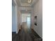 Inviting hallway featuring wood floors leading to an open, light-filled living space at 6642 Star Dr, Sherrills Ford, NC 28673