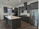 Modern kitchen featuring gray cabinets, stainless steel appliances, and a large island at 6642 Star Dr, Sherrills Ford, NC 28673