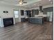 Open-concept kitchen and living room with island, stainless steel appliances and fireplace at 6642 Star Dr, Sherrills Ford, NC 28673