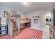 Cozy bedroom features a custom-built loft bed with wooden steps and comic-themed wall decor at 724 Lagan Ct, Fort Mill, SC 29715