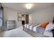Cozy bedroom with neutral tones, a wood frame bed, and direct access to an ensuite bathroom at 724 Lagan Ct, Fort Mill, SC 29715