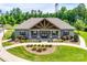 Beautiful clubhouse with stone accents, manicured landscaping, and a welcoming entrance at 724 Lagan Ct, Fort Mill, SC 29715