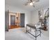 Home office features neutral carpet, a gray desk, and a view of the mudroom at 724 Lagan Ct, Fort Mill, SC 29715
