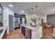 Modern kitchen with stainless steel appliances, granite countertops, and dark cabinets at 724 Lagan Ct, Fort Mill, SC 29715