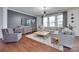 Comfortable living room with a large sectional, stylish decor, and ample natural light at 724 Lagan Ct, Fort Mill, SC 29715
