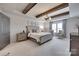 Spacious main bedroom featuring wood beam details, neutral walls, and bright windows at 724 Lagan Ct, Fort Mill, SC 29715