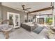 Relaxing covered patio with comfortable seating, ceiling fans, and stylish decor at 724 Lagan Ct, Fort Mill, SC 29715